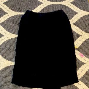 black skirt, goes below knee length